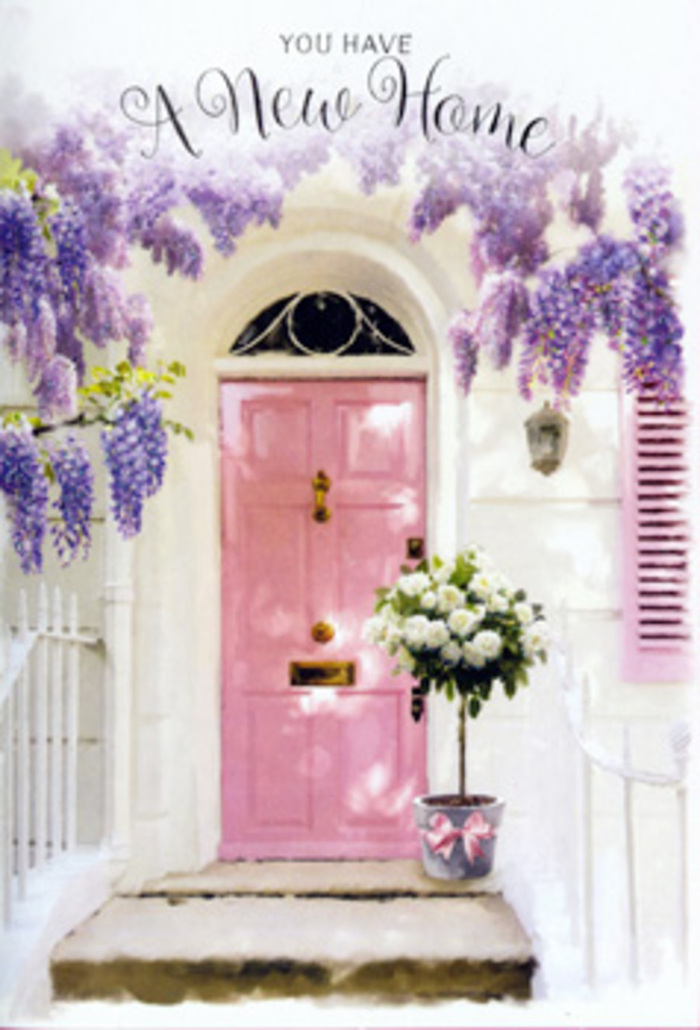 In this image, a tranquil doorway scene conjures up the spirit of Highbury's quieter streets, where pastel houses and climbing plants often greet you as you head towards the green calm of Highbury Fields. At the centre stands a softly coloured pink door, painted in a muted, powdery shade that feels both elegant and approachable. The door is set into a simple whitewashed wall, its surface bearing that slightly mottled texture you get from limewash, catching sunlight in delicate, irregular highlights. Above and around the door, wisteria cascades in generous sweeps of lavender and lilac, its woody stems twisting along unseen supports. The flower clusters hang in different lengths, some brushing down towards the top of the door, others arching further out, suggesting a plant that has been allowed to grow freely over many seasons. The impression is of abundant, fragrant bloom-exactly the sort of sight and scent that might stop you in your tracks on a stroll through Highbury. At the foot of the door, placed carefully on the threshold, is a florist's arrangement displayed in a rustic grey tin bucket. The bucket itself has a slightly weathered look, a soft contrast to the smooth paint of the door. Packed inside are ivory and cream roses in full bloom, their petals thick, curled, and layered, creating a sense of lush volume. Interspersed between the roses, clusters of fresh green foliage add texture and a touch of wildness, preventing the design from feeling too formal. Around the bucket's base, a pale pink ribbon is tied in a neat bow, its shade echoing the door and creating visual harmony from top to bottom. The overall mood is hopeful, contemplative, and quietly joyful-exactly the feeling you might want to send to someone starting a new chapter in a Highbury home. The flowers suggest a heartfelt welcome, promising warmth, security, and countless gentle moments yet to unfold on the other side of that pink door.